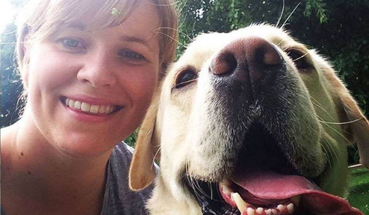 Susanna and Apache the Labrador pose for the camera