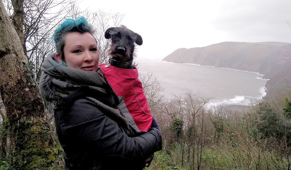 Winter and Rose on holiday in Exmoor with a stunning coastal view