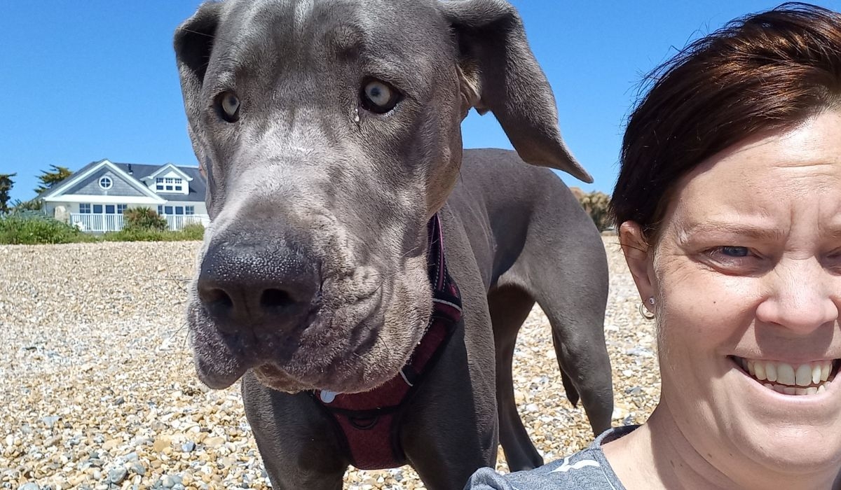 Member Claire Webb with her borrowed doggie on the beach