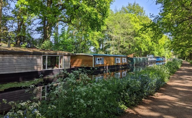 Boathouses on the river along Basingstoke Canal, Basingstoke